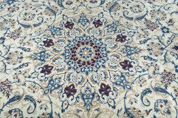 Backside of handmade New Nain rug showing knot structure and weave density