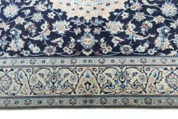 Corner detail of New Nain rug showing border pattern and Wool pile