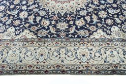 Corner detail of New Nain rug showing border pattern and Wool pile