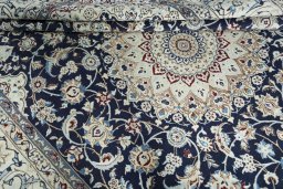 Close-up detail of New Nain rug from Iran / Persia showing Wool weave