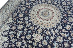 Backside of handmade New Nain rug showing knot structure and weave density