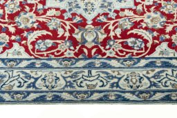 Corner detail of 2000s Nain rug showing border pattern and Wool pile