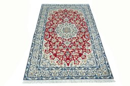 Surface texture of 2000s Nain rug with natural Wool and intricate pattern