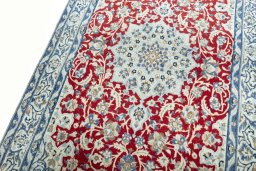 Backside of handmade 2000s Nain rug showing knot structure and weave density