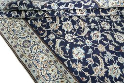 Close-up detail of New Nain rug from Iran / Persia showing Wool weave