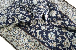 Surface texture of New Nain rug with natural Wool and intricate pattern