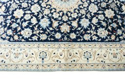 Corner detail of 2000s Nain rug showing border pattern and Wool pile