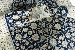 Surface texture of 2000s Nain rug with natural Wool and intricate pattern