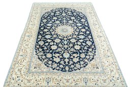 Surface texture of 2000s Nain rug with natural Wool and intricate pattern