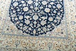 Close-up detail of 2000s Nain rug from Iran / Persia showing Wool weave