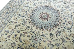 Backside of handmade New Nain rug showing knot structure and weave density