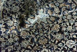 Surface texture of 2000s Nain rug with natural Wool and intricate pattern