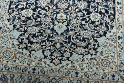 Close-up detail of 2000s Nain rug from Iran / Persia showing Wool weave