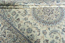 Backside of handmade New Nain rug showing knot structure and weave density
