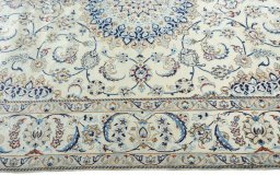Corner detail of New Nain rug showing border pattern and Wool pile