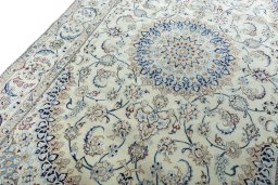 Backside of handmade New Nain rug showing knot structure and weave density