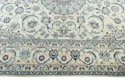 Corner detail of New Nain rug showing border pattern and Wool pile