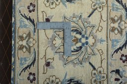 Backside of handmade New Nain rug showing knot structure and weave density