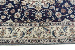 Corner detail of New Nain rug showing border pattern and Cork pile