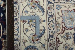 Backside of handmade New Nain rug showing knot structure and weave density