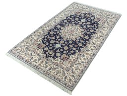 Corner detail of New Nain rug showing border pattern and Cork pile