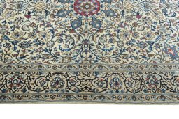 Corner detail of 2000s Nain rug showing border pattern and Wool pile