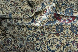 Surface texture of 2000s Nain rug with natural Wool and intricate pattern