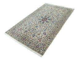 Corner detail of 2000s Nain rug showing border pattern and Wool pile