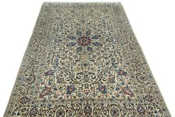 Surface texture of 2000s Nain rug with natural Wool and intricate pattern