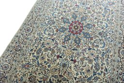 Backside of handmade 2000s Nain rug showing knot structure and weave density