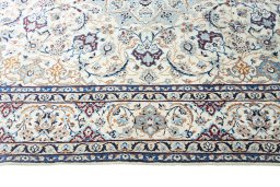 Corner detail of New Nain rug showing border pattern and Wool pile