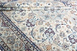 Close-up detail of New Nain rug from Iran / Persia showing Wool weave