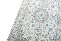 Backside of handmade New Nain rug showing knot structure and weave density