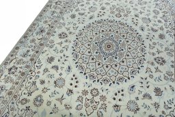 Backside of handmade New Nain rug showing knot structure and weave density