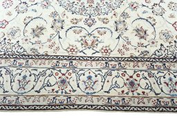 Corner detail of 2000s Nain rug showing border pattern and Wool pile