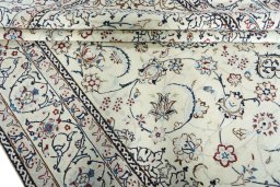 Close-up detail of 2000s Nain rug from Iran / Persia showing Wool weave
