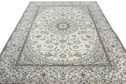 Surface texture of 2000s Nain rug with natural Wool and intricate pattern