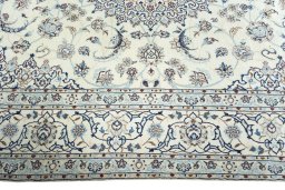 Corner detail of 2000s Nain rug showing border pattern and Wool pile