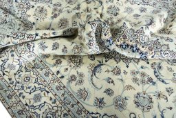 Surface texture of 2000s Nain rug with natural Wool and intricate pattern