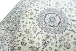 Backside of handmade 2000s Nain rug showing knot structure and weave density