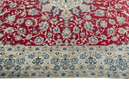 Corner detail of 2000s Nain rug showing border pattern and Wool pile