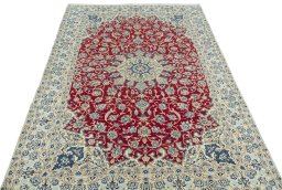 Surface texture of 2000s Nain rug with natural Wool and intricate pattern