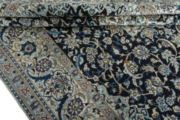 Close-up detail of 2000s Nain rug from Iran / Persia showing Wool weave