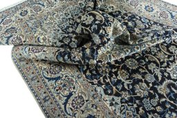 Surface texture of 2000s Nain rug with natural Wool and intricate pattern