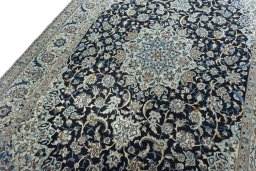 Backside of handmade 2000s Nain rug showing knot structure and weave density