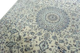 Backside of handmade New Nain rug showing knot structure and weave density
