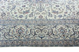 Corner detail of New Nain rug showing border pattern and Silk pile