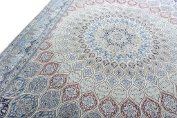Backside of handmade New Nain rug showing knot structure and weave density