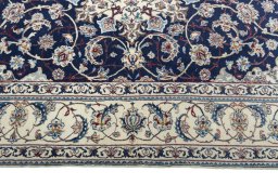 Corner detail of New Nain rug showing border pattern and Cork pile