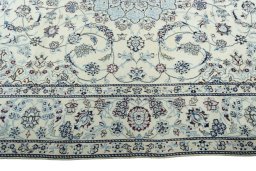 Corner detail of New Nain rug showing border pattern and Wool pile